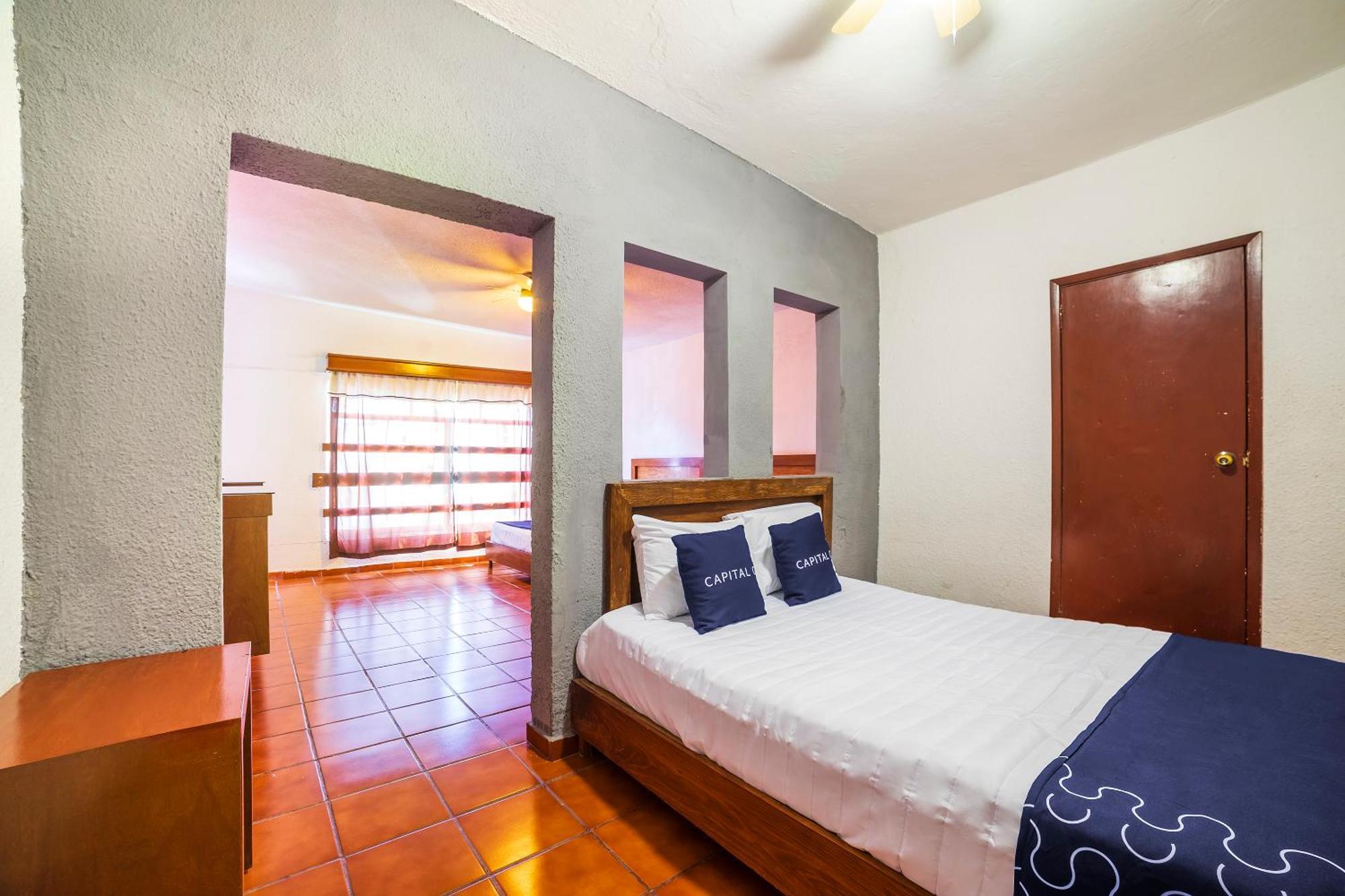 Capital O Hotel Casa Blanca เคลาญา ภายนอก รูปภาพ
