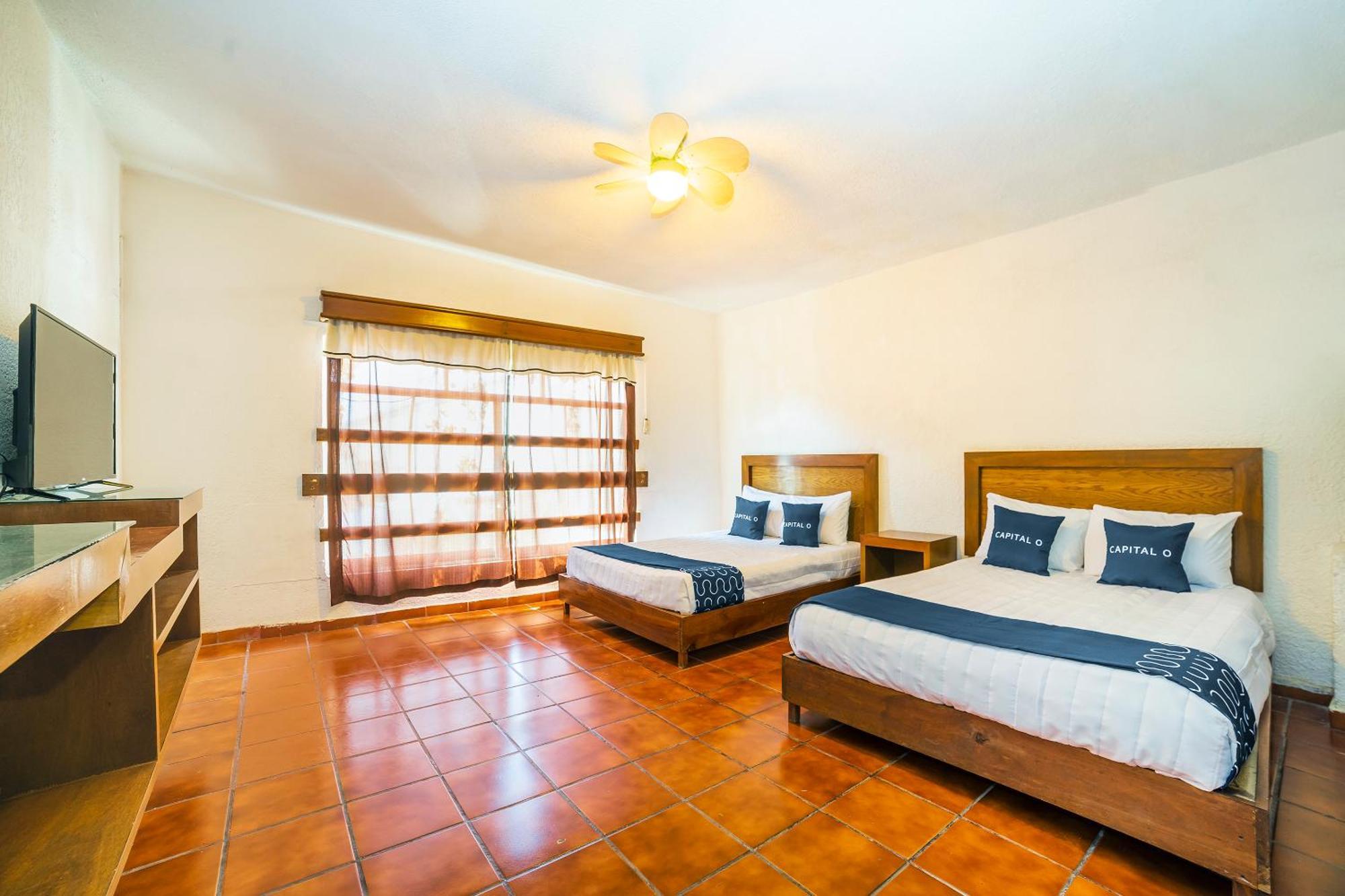 Capital O Hotel Casa Blanca เคลาญา ภายนอก รูปภาพ